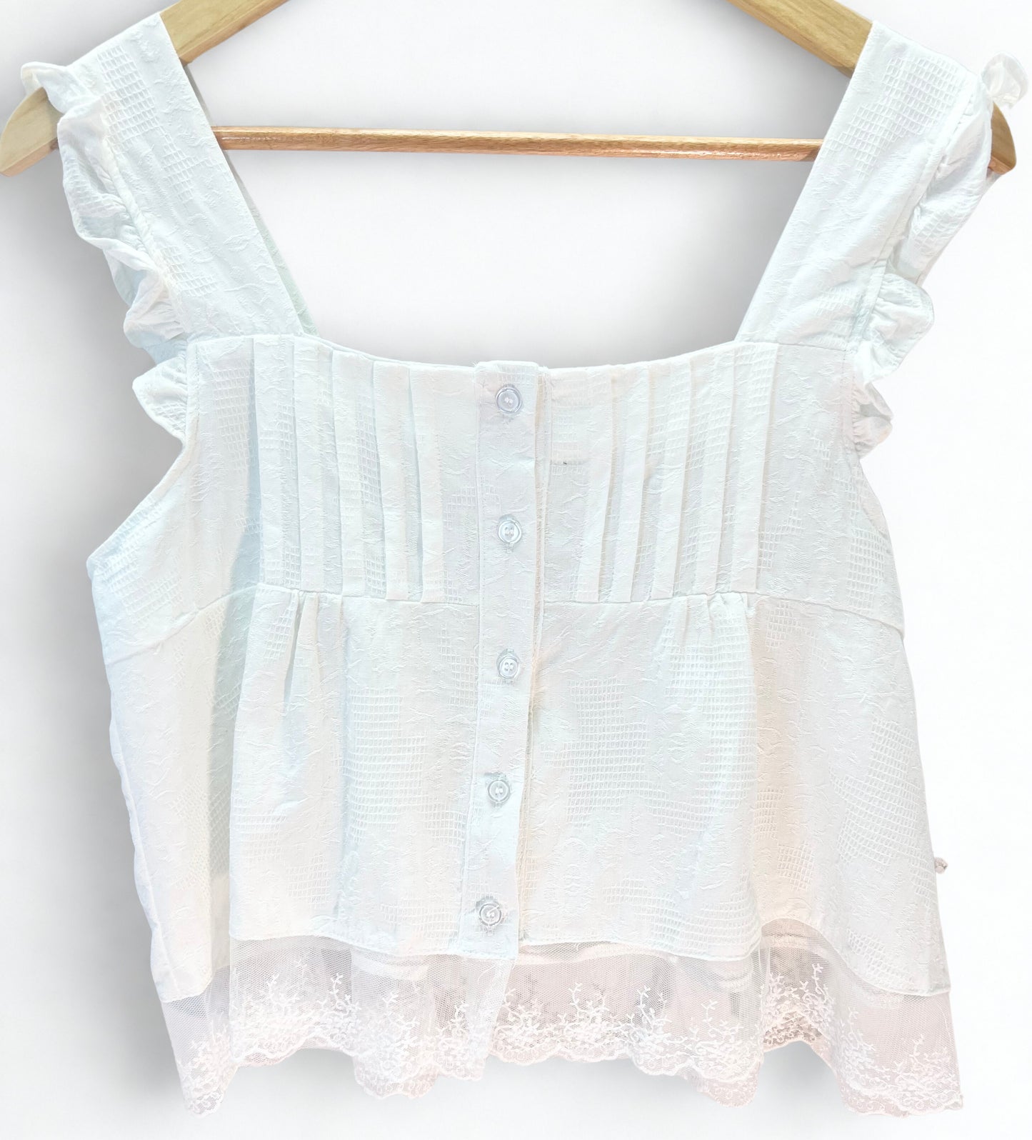 Noira Blanc – White Ruffle Strap Cotton Blouse with Lace Hem